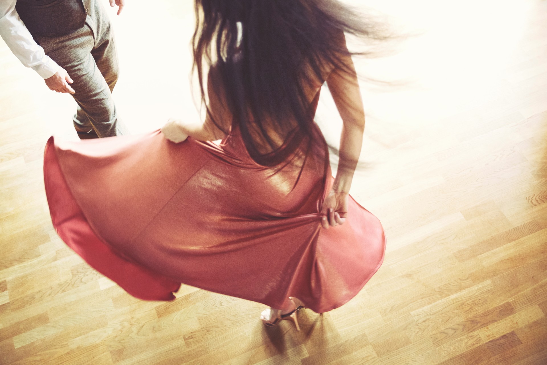 Dancing couple in the light dance hall